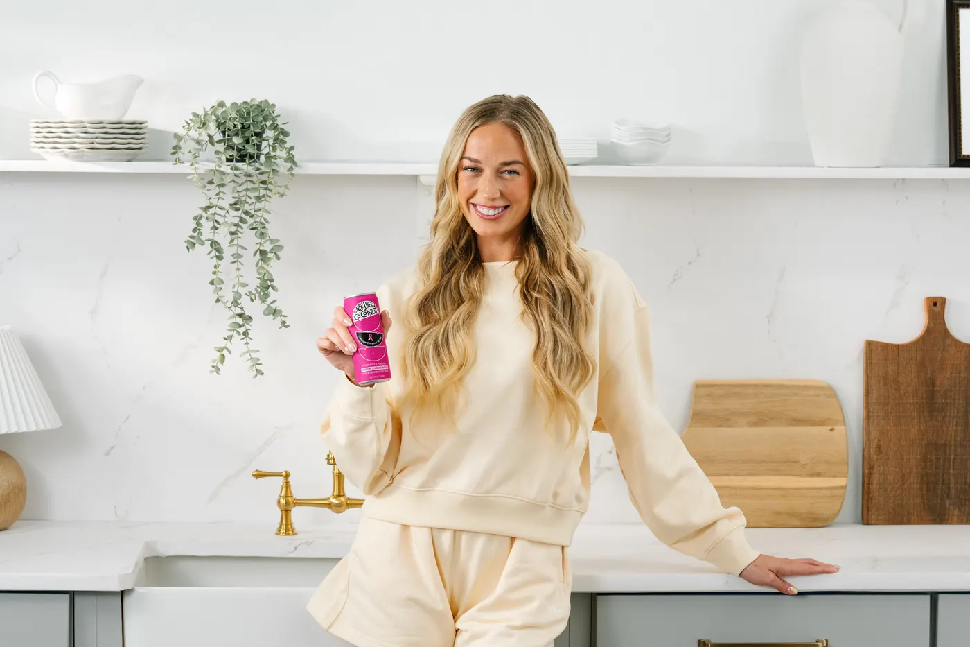 Sophie Cunningham holding the limited-edition Once Upon a Coconut can
